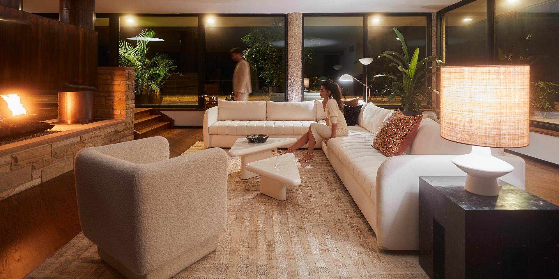 Brazilian modern living room with models in the evening. Get the look