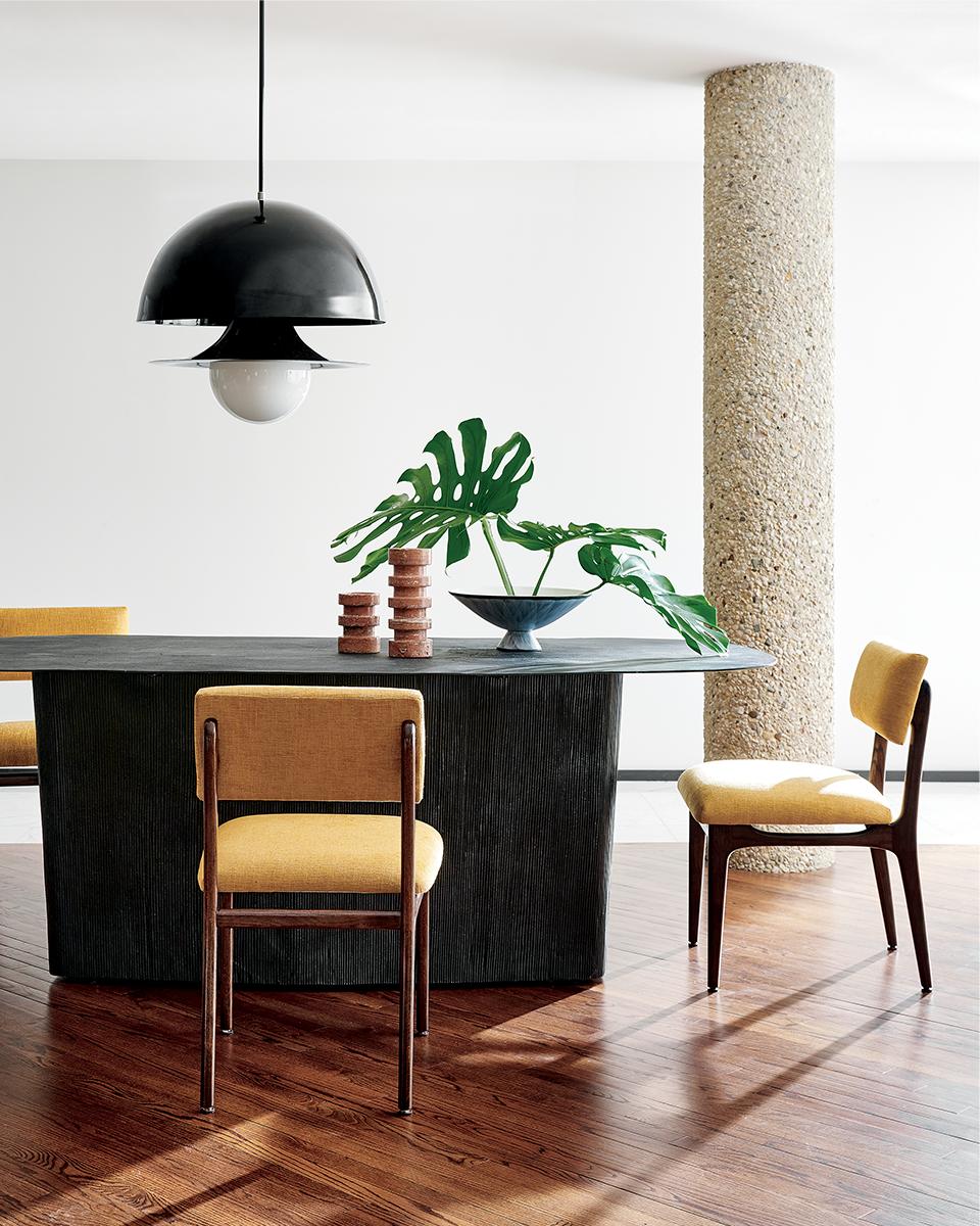 Modern dining room with Origin Cast Metal Dining Table and Selby Canary Upholstered Dining Chairs. Get the look