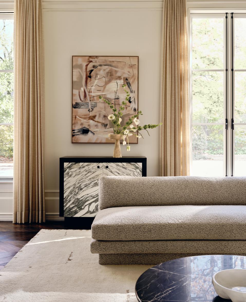 living room sectional, dining table, painting & flowers