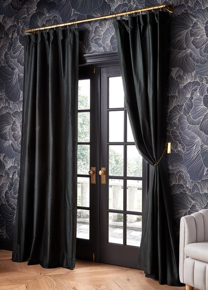 dark green curtains with gold curtain hardware