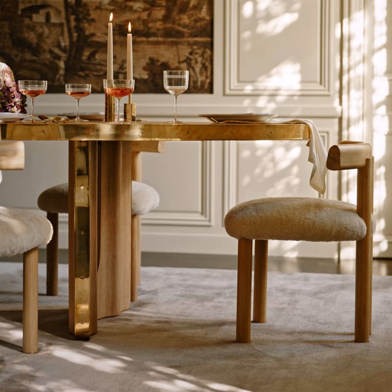 Play Albertine 110" Oval Oak Wood and Unlacquered Brass Dining Table by goop - video 1 of 1