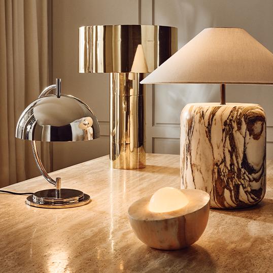 4 modern table lamps displayed on table