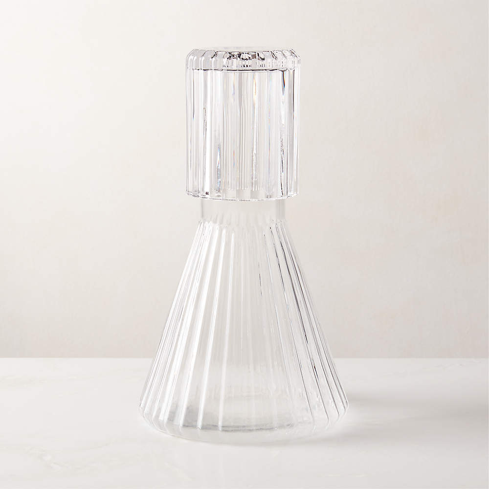 https://cb2.scene7.com/is/image/CB2/AlericClrRbbdCarafeNCupSHS22/$web_pdp_main_carousel_sm$/211115123105/aleric-ribbed-glass-carafe-and-cup.jpg