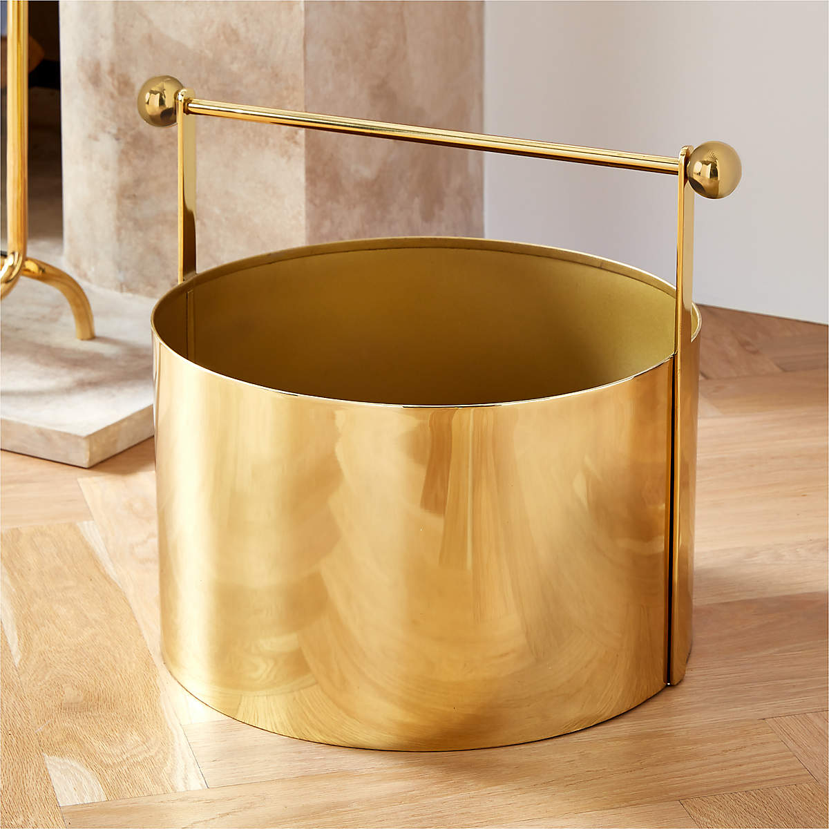 Ameil Polished Brass Fireplace Log Holder | CB2