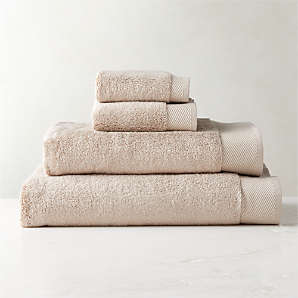 https://cb2.scene7.com/is/image/CB2/ArlowNeutOrgCttnBathGroupFHS23/$web_plp_card_mobile$/220915135947/arlow-organic-cotton-light-taupe-bath-towels.jpg