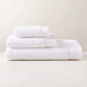 https://cb2.scene7.com/is/image/CB2/ArlowWhtOrgCttnBthTwlBndSHS23/$web_pdp_carousel_low$/221227170016/arlow-organic-cotton-white-bath-towel-set.jpg