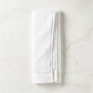 https://cb2.scene7.com/is/image/CB2/ArlowWhtOrgCttnHandTowelSHS23/$web_plp_card_mobile$/220914162903/arlow-organic-cotton-white-hand-towel.jpg