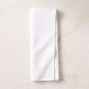 https://cb2.scene7.com/is/image/CB2/ArmelaWhtWaffleHandTowelSHF23/$web_plp_card_mobile$/230327152024/armela-organic-cotton-white-waffle-hand-towel.jpg