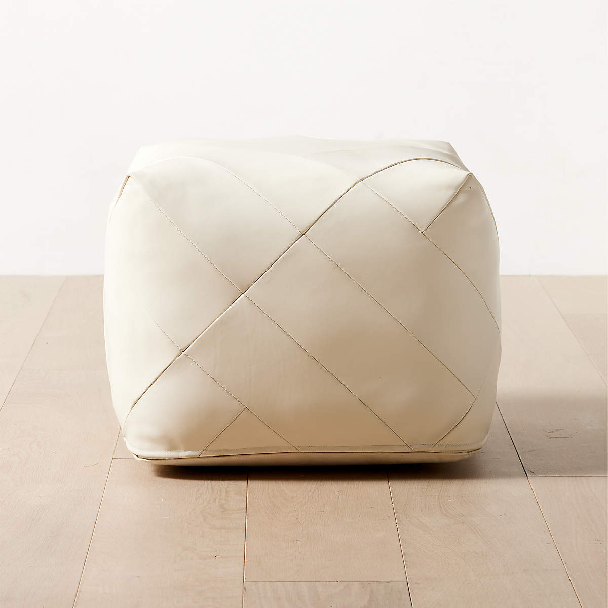 Aslant Warm White Leather Pouf Ottoman + Reviews | CB2