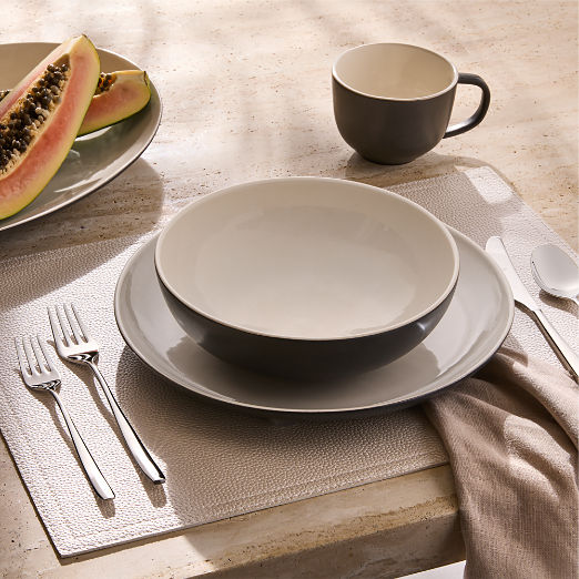 Barchan 4-Piece Black and Warm White Stoneware Dinnerware Set by Kravitz Design