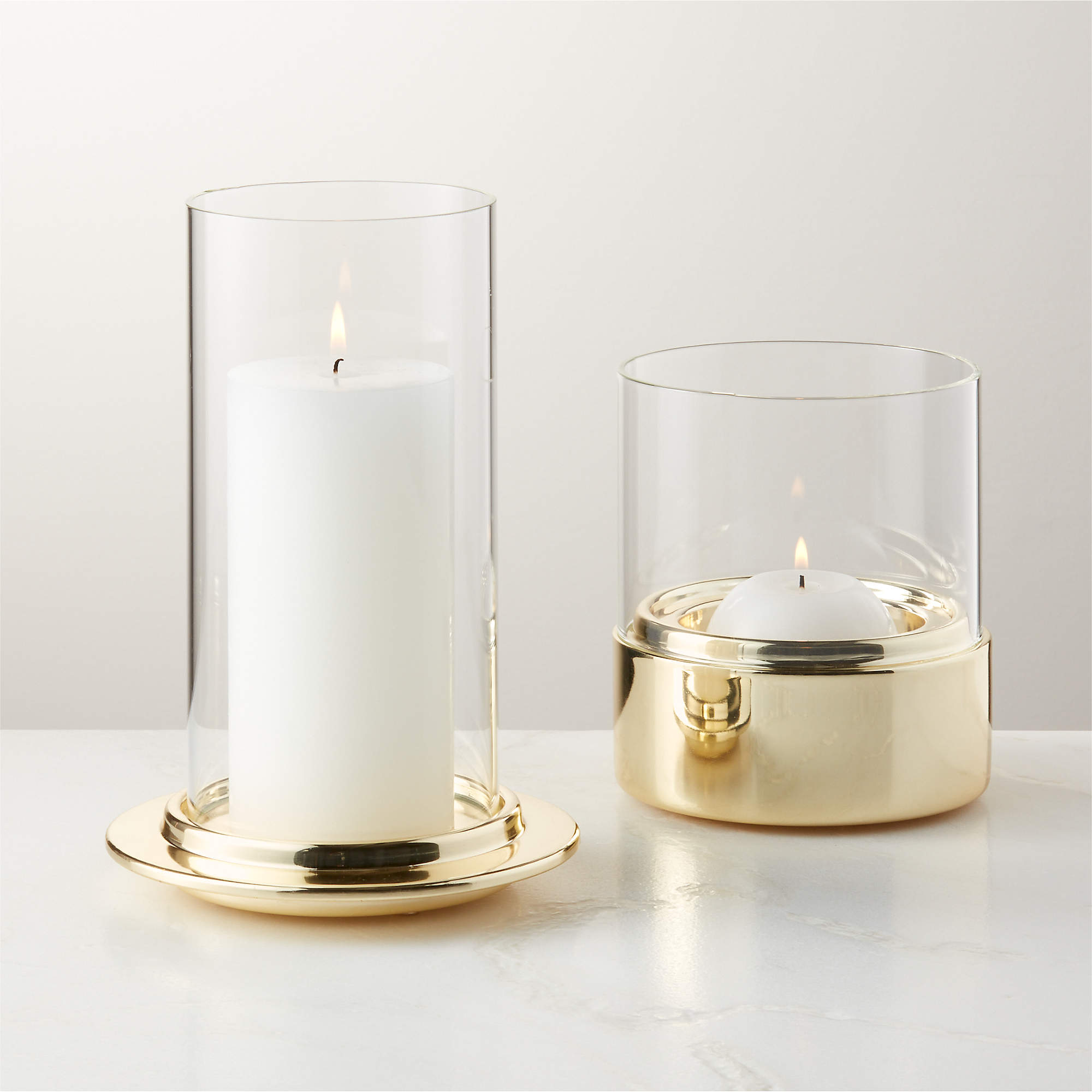 Alta and Bassa Champagne Brass Hurricane Candle Holders CB2