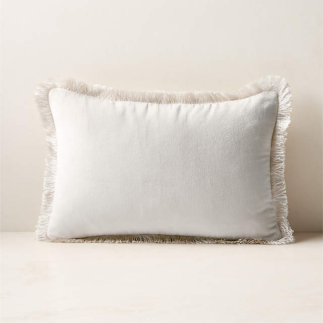 https://cb2.scene7.com/is/image/CB2/BettieEcruDnAltPllw18x12SHF23/$web_pdp_main_carousel_zoom_xs$/231002155915/bettie-warm-white-velvet-throw-pillow-18x12.jpg