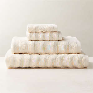 https://cb2.scene7.com/is/image/CB2/BrooksWrmWhtOrgCttnGroupFHF23/$web_plp_card_mobile$/230512115020/brooks-ribbed-organic-cotton-warm-white-bath-towels.jpg