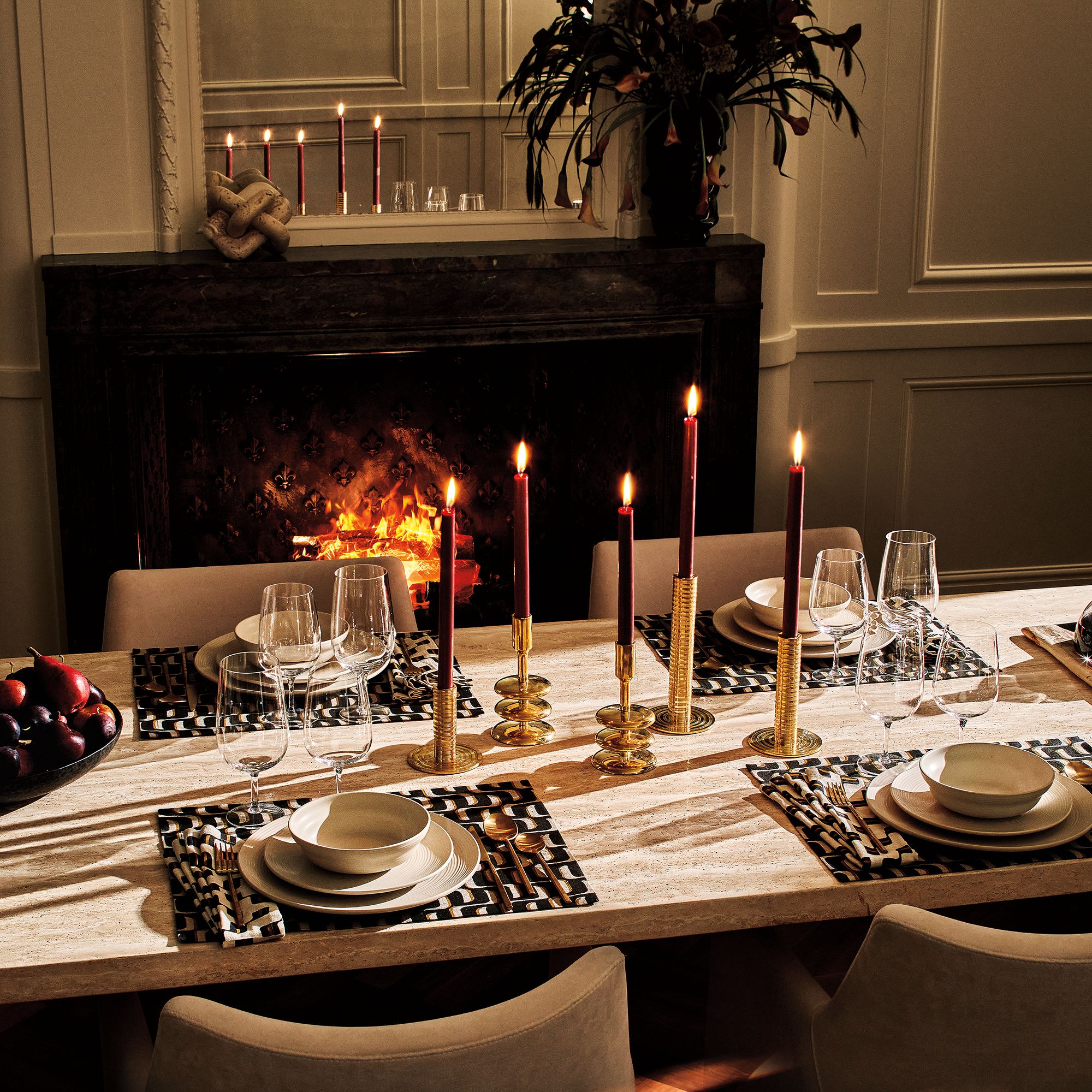 Dining table set for an evening meal.