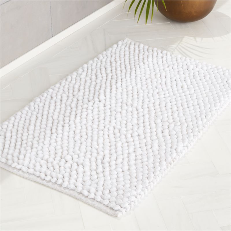 white fluffy bath mat
