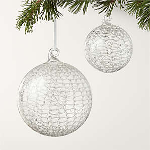 https://cb2.scene7.com/is/image/CB2/EiraGlassRndOrnamentGrpHolFHF23/$web_plp_card_mobile$/230809164642/eira-round-clear-laced-glass-christmas-tree-ornaments.jpg