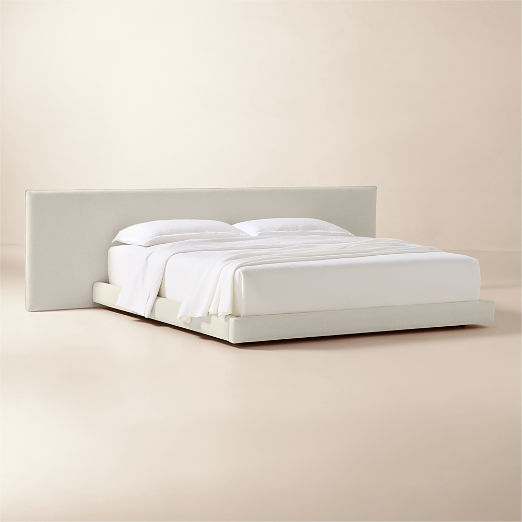 Facade Warm White Upholstered Extended King Bed