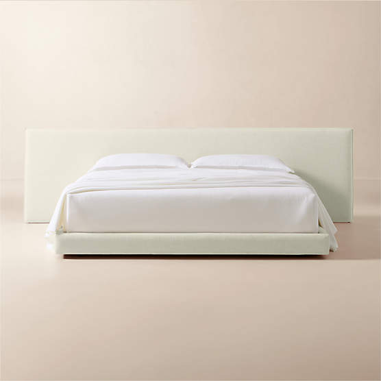 Facade Warm White Upholstered Extended King Bed