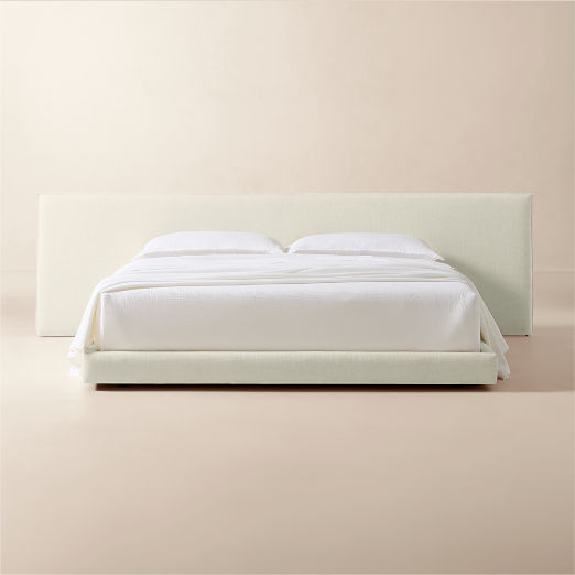 Facade Warm White Upholstered Extended King Bed