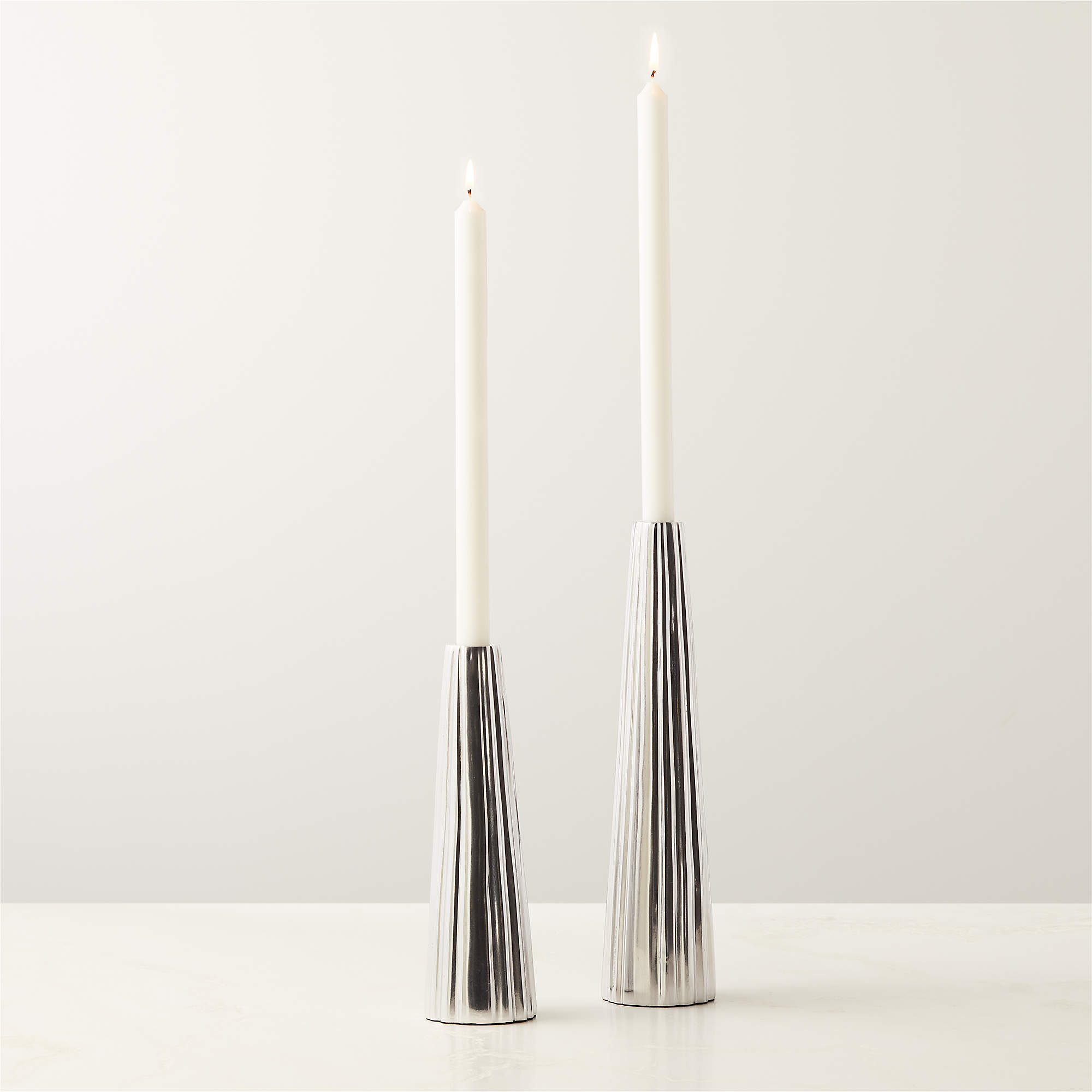 Filla Polished Cast Aluminum Taper Candle Holders CB2 Canada