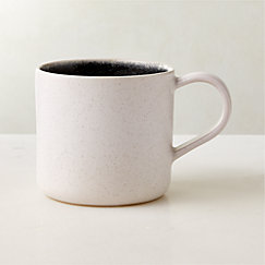 https://cb2.scene7.com/is/image/CB2/FlynnRctvMugSHS23/$web_LineItem$&wid=243&hei=243/221006172010/fynn-black-and-white-coffee-mug-with-reactive-glaze.jpg