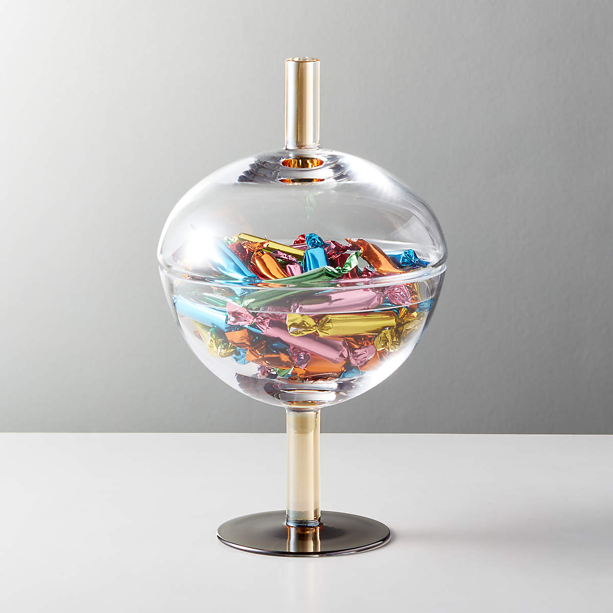 Spherical candy dish with gold stand and handle on lid