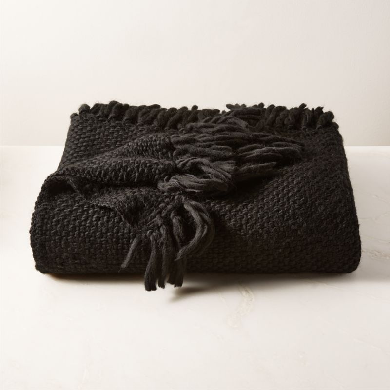 Black throw with online tassels