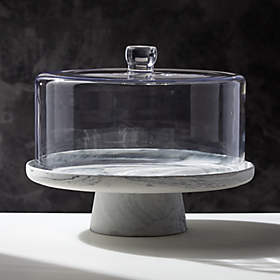 https://cb2.scene7.com/is/image/CB2/JFSwirlCakeStandWGlassLidSHF20/$web_recently_viewed_item_sm$/200914131918/swirl-cake-stand-with-glass-lid.jpg