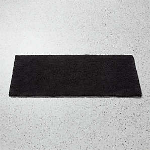 https://cb2.scene7.com/is/image/CB2/KalaniBlackBathRunnerSHF23/$web_plp_card_mobile$/230525094532/kalani-organic-cotton-black-bath-runner-rug-24x60.jpg