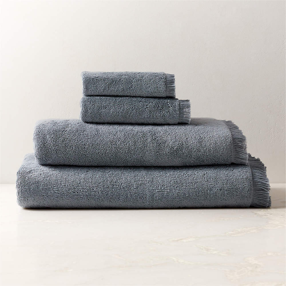 https://cb2.scene7.com/is/image/CB2/KamillaBlOgCtnCollectionFHF23/$web_pdp_main_carousel_sm$/230327152028/kindred-organic-cotton-blue-bath-towels.jpg