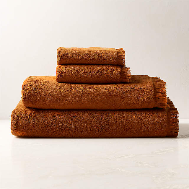 https://cb2.scene7.com/is/image/CB2/KamillaTwnyOgCtnCollectionFHF23/$web_pdp_main_carousel_zoom_xs$/230327152023/kindred-organic-cotton-tawny-bath-towels.jpg