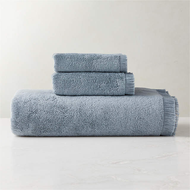 https://cb2.scene7.com/is/image/CB2/KindredOrgCttnBlueBathGroupFHS23/$web_pdp_main_carousel_zoom_xs$/220915170831/kindred-organic-cotton-blue-bath-towels.jpg