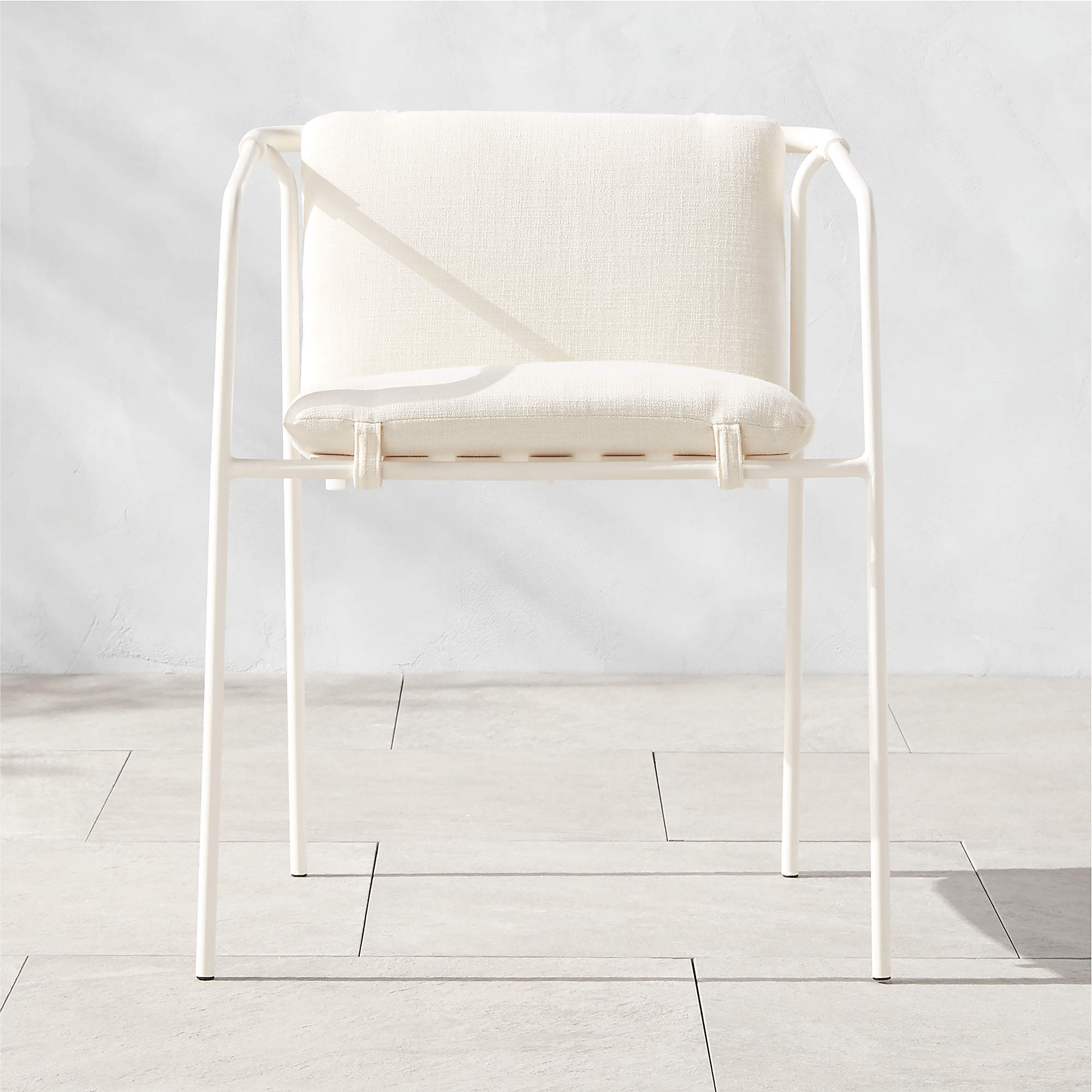 Navene Modern White Outdoor Dining Armchair with White Cushions CB2