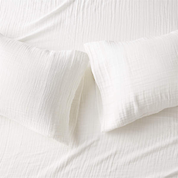 https://cb2.scene7.com/is/image/CB2/OrgCttnGzWhtStdCaseS2SHF23/$web_pdp_main_carousel_xs$/240215085122/organic-cotton-gauze-white-standard-pillowcases-set-of-2.jpg