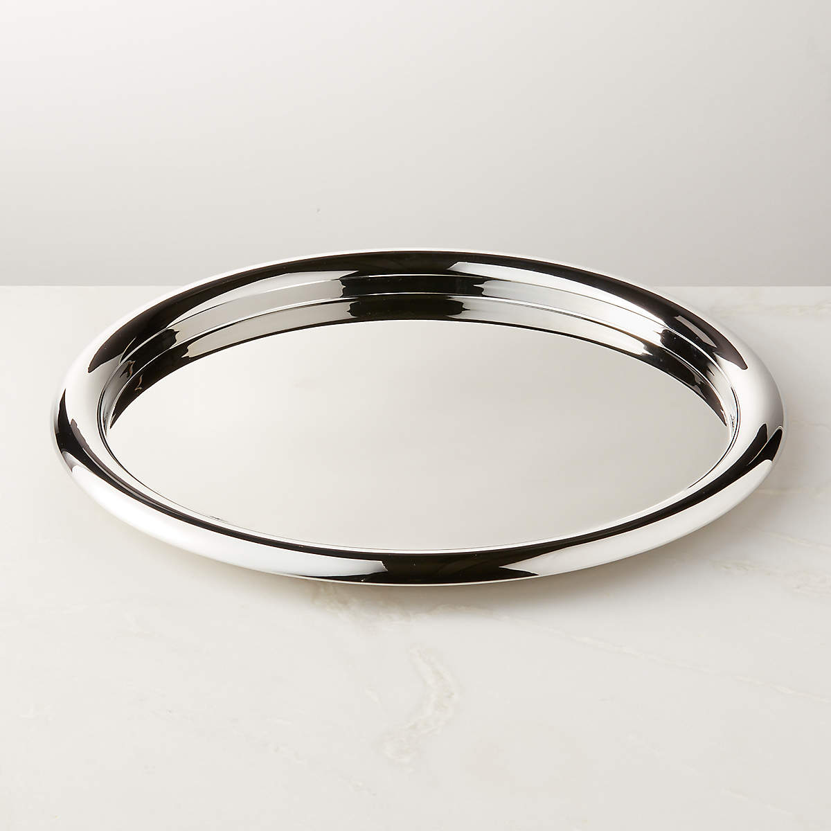 Piero Round Polished Stainless Steel Serving Tray by Gianfranco Frattini + Reviews | CB2