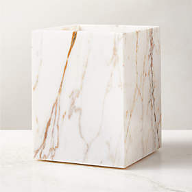 https://cb2.scene7.com/is/image/CB2/RamseyGldClctMrbWastecanSHF23/$web_recently_viewed_item_sm$/230720101407/ramsey-calacatta-gold-marble-wastebasket.jpg