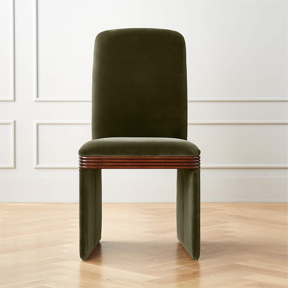 https://cb2.scene7.com/is/image/CB2/RhodesGnVltUphlsdDngChrSHF21/$web_pdp_main_carousel_sm$/210621100844/rhodes-green-upholstered-velvet-dining-chair.jpg