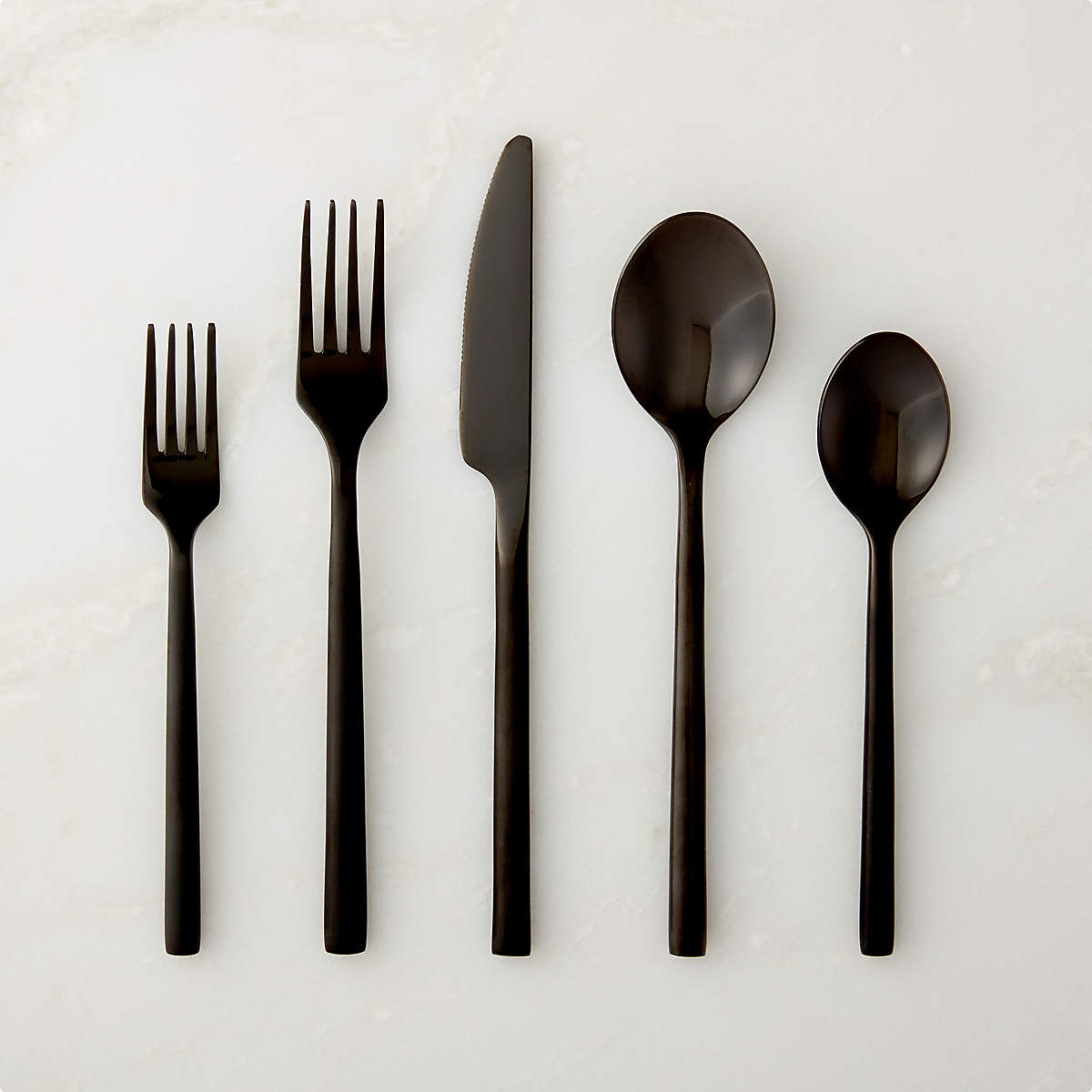 https://cb2.scene7.com/is/image/CB2/RushBrhdBlkFltwr20PcSSHS22/$web_pdp_main_carousel_md$/211217132916/20-piece-rush-brushed-black-flatware-set.jpg