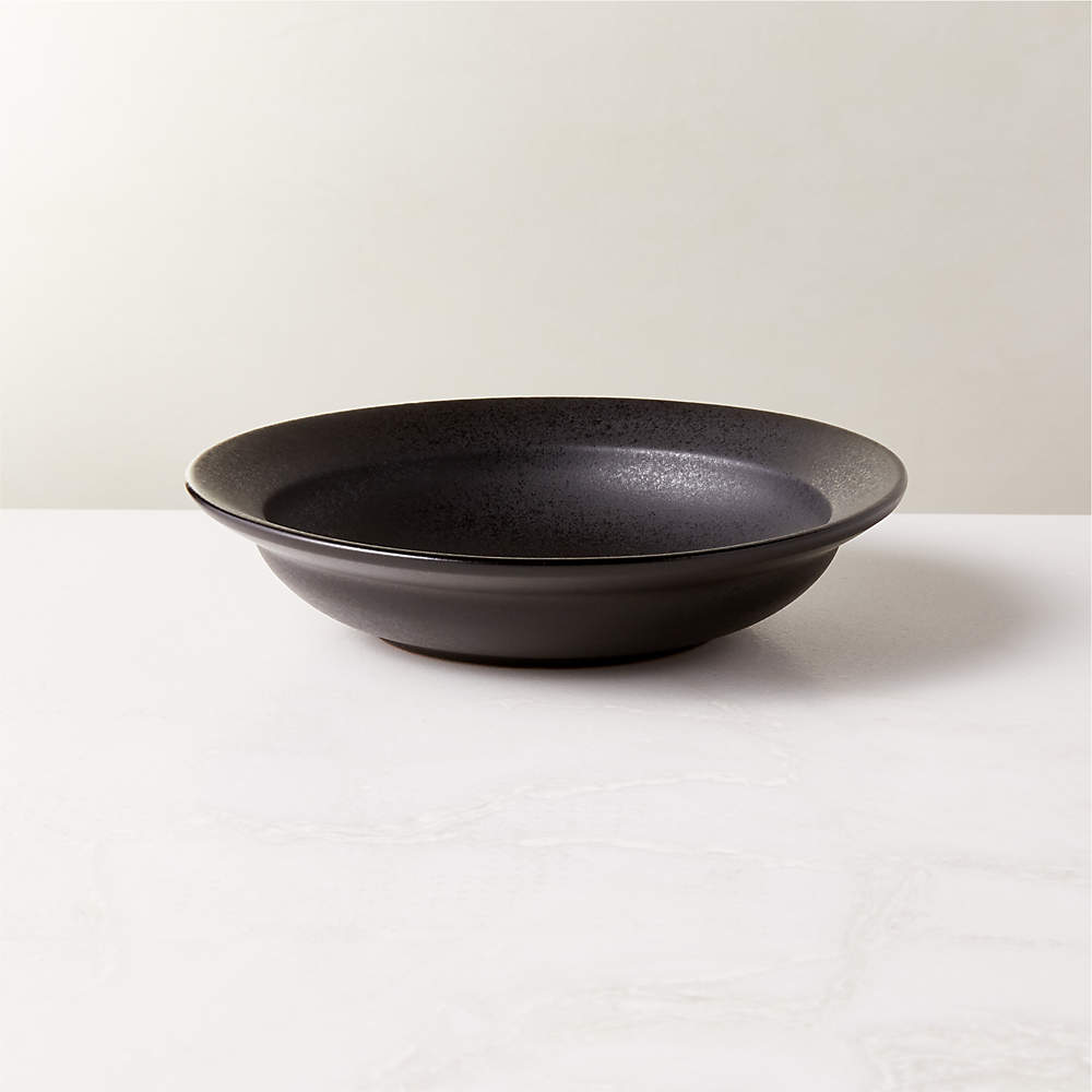 https://cb2.scene7.com/is/image/CB2/SculptBlkTrrcttPastaBowlSHF22/$web_pdp_main_carousel_sm$/220627122605/sculpt-terra-cotta-black-pasta-bowl.jpg