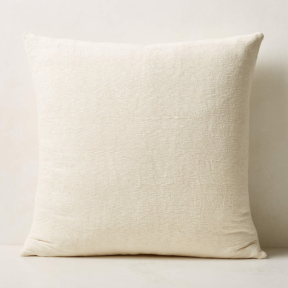 https://cb2.scene7.com/is/image/CB2/SecaBleachedPillow26inSHS23/$web_pdp_main_carousel_sm$/221125104539/seca-bleached-silk-throw-pillow-26.jpg