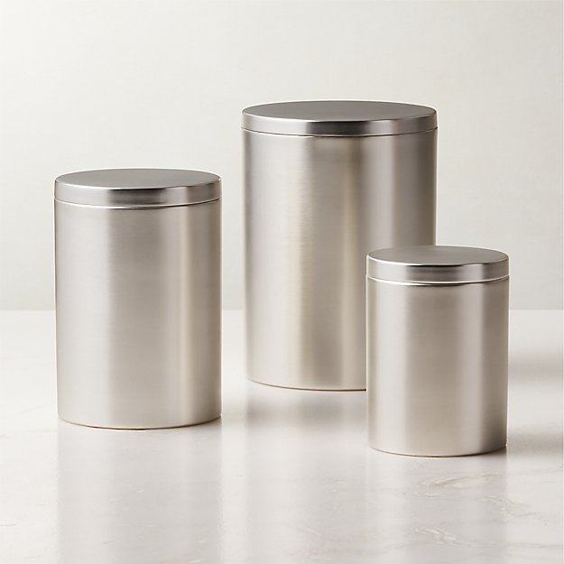 https://cb2.scene7.com/is/image/CB2/SilverPlatedCanistersS3SHF23/$web_product_hero$&/230414115642/silver-plated-canisters.jpg