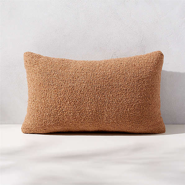 https://cb2.scene7.com/is/image/CB2/SilvesBclCmlODPillow20x12SHS23/$web_plp_card_mobile_hires$/230113113621/silves-camel-brown-boucle-outdoor-throw-pillow-20x12.jpg