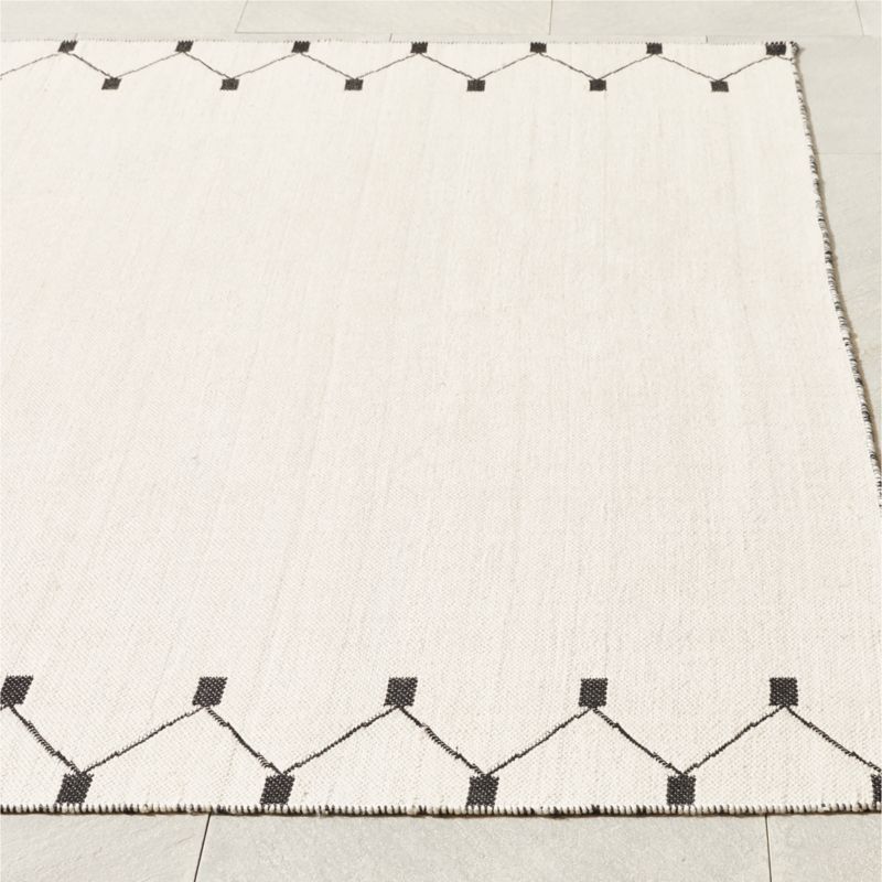 Sorena Black and Warm White Indoor/Outdoor Reversible Performance Area ...