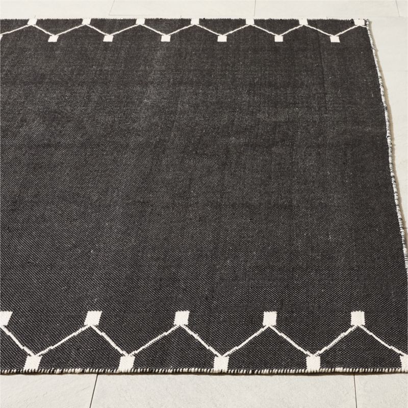 Sorena Black and Warm White Indoor/Outdoor Reversible Performance Area