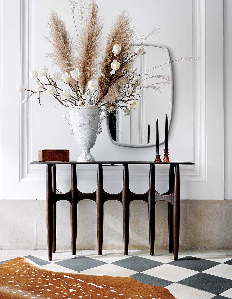 modern entryway with wood console table