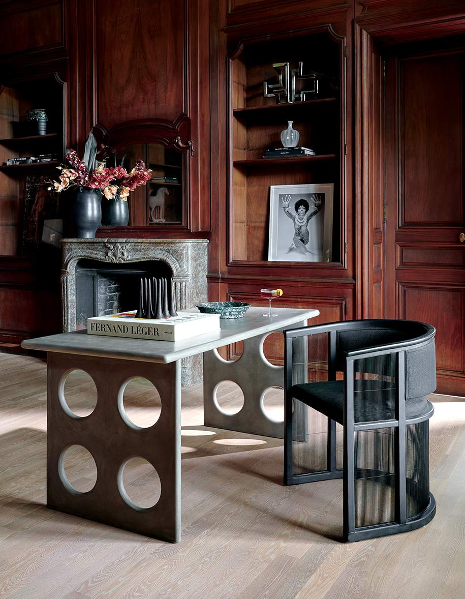 office with all concrete table and black chair